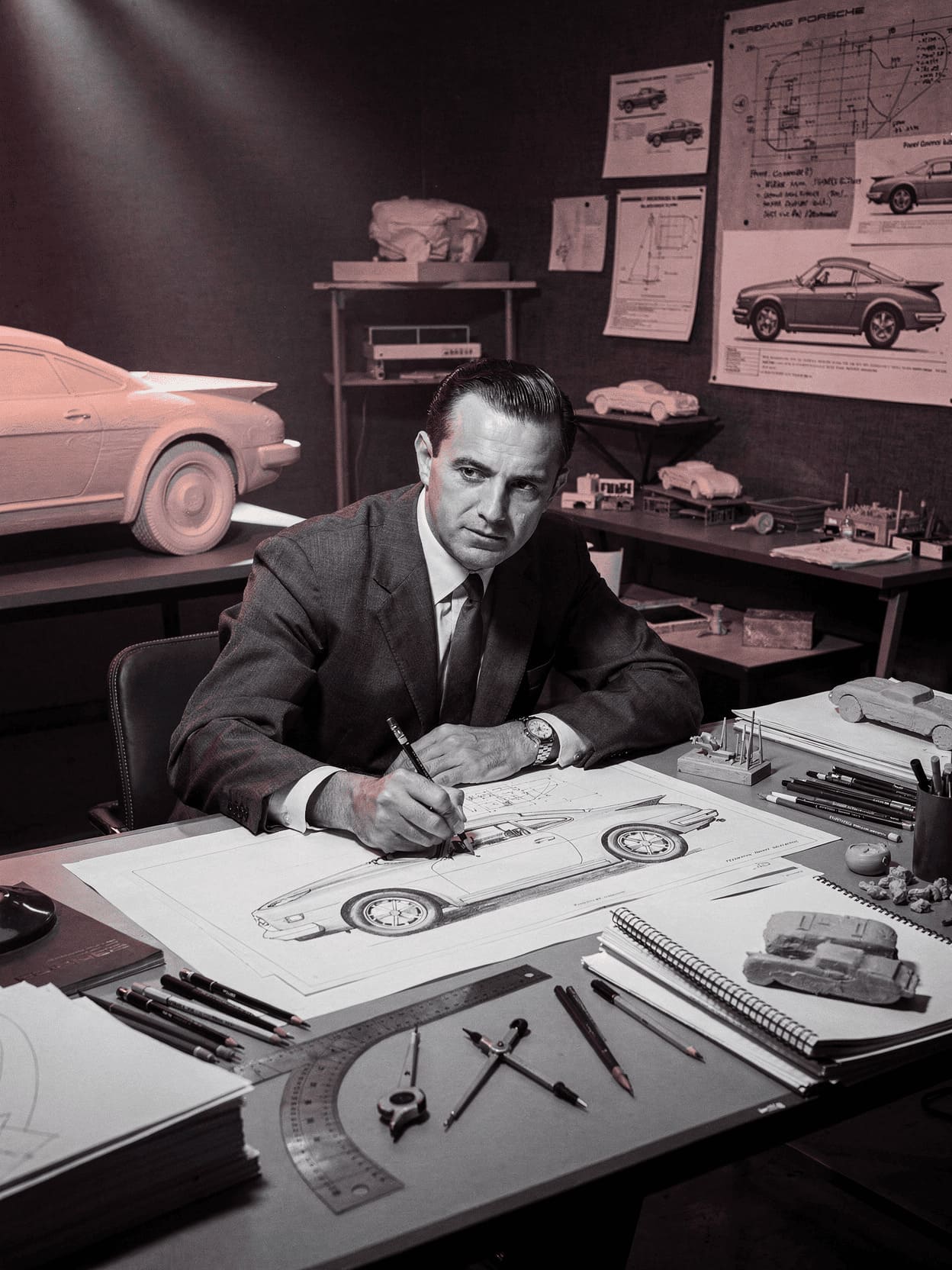 Ferdinand Alexander Porsche in design studio working on car sketches black